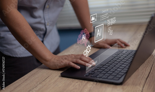 Business person using laptop with virtual AI ,Concept of artificial intelligence, machine learning, and digital media innovation transforming data future modern business technology