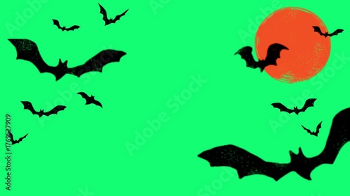 Spooky bats fly across a bright green sky as a big orange moon rises, perfect for Halloween themed content and scary promotions this October