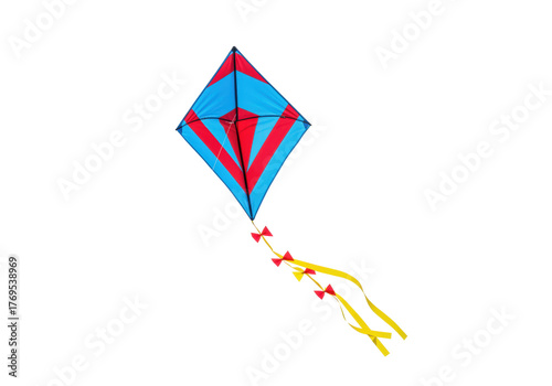 Isolated red and blue diamond shaped kite with yellow ribbons, ready to fly outdoors