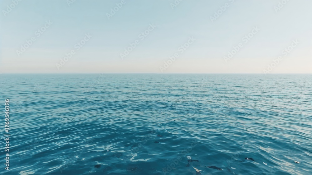 Obraz premium A peaceful blue sea and gradient sky backdrop