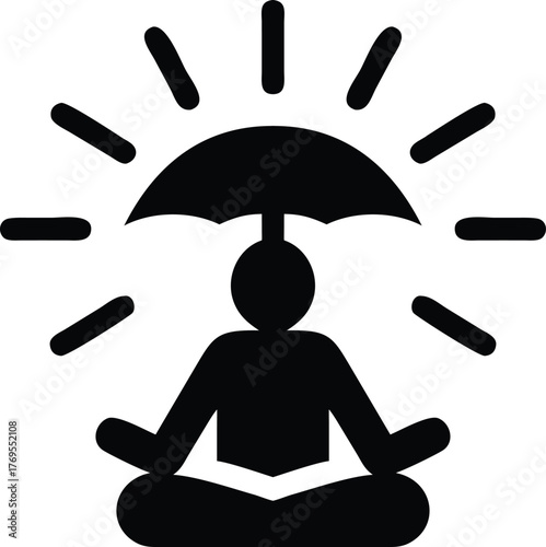 Silhouette of person meditating under an umbrella with radiating light
