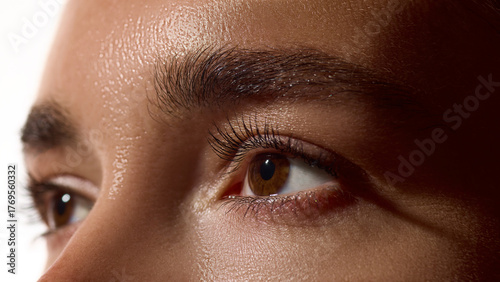 Cuadro en lienzo Eyes and brows close-up with glowing natural skin under soft light