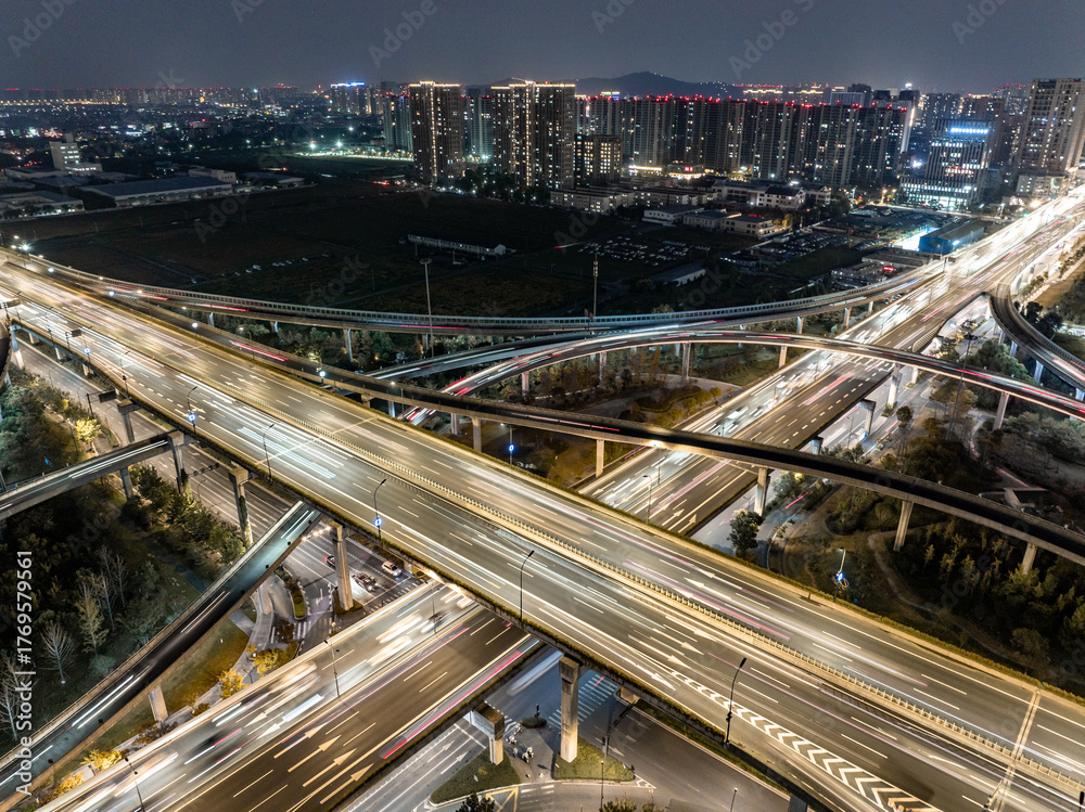 Naklejka premium Aerial views of urban highways and interchanges at sunrise