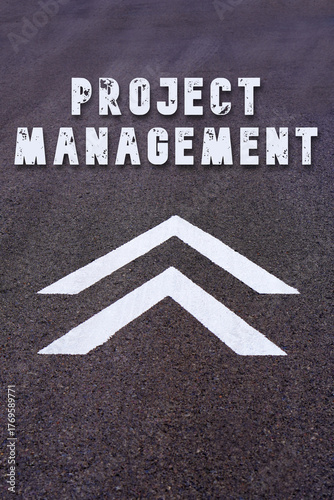 project management concept. words written on the asphalt about arrows of progress or growth
