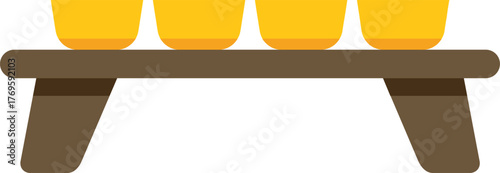 Four yellow bowls are placed on a low wooden table, possibly for an offering or ritual