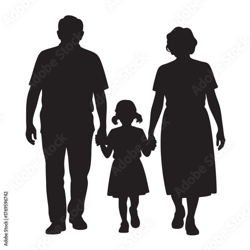 Silhouette of a loving family with grandparents and a young child walking together holding hands