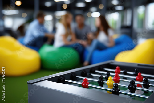 Friends play foosball in a cozy lounge this afternoon