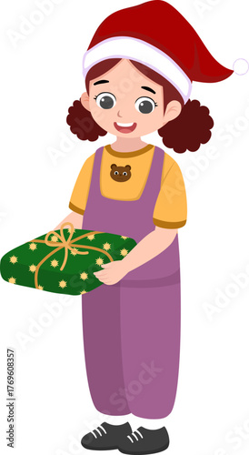 A little girl wearing a Santa hat is standing while carrying Christmas presents.