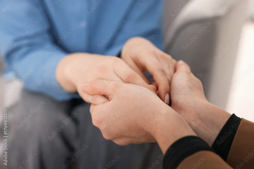 Obraz premium Psychologist supporting woman during therapy session indoors, closeup