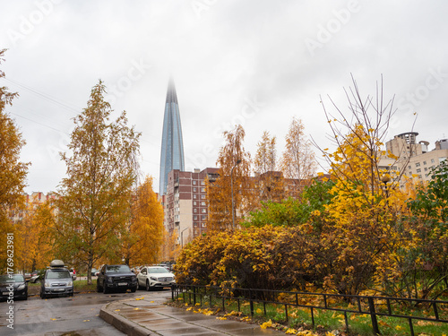 A courtyard of residential buildings in the background of Lakhta Center on the shores of the Gulf of Finland in the Primorsky District of St. Petersburg