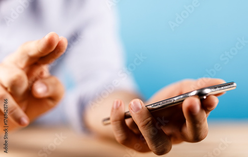 Close-up of a man's hand in...