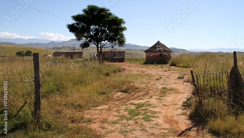 Dirt roads in the QwaQwa villages, located in the mountainous region of the Free State province in South Africa. Drakensberg mountain in the background. 