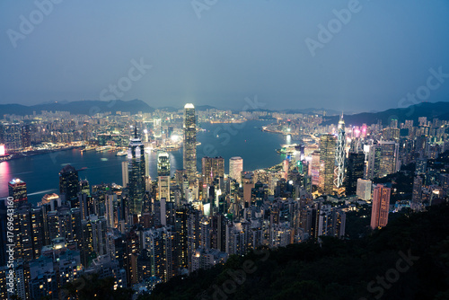 Wallpaper Mural View of vibrant city lights reflecting off the harbor waters, illuminating the towering skyscrapers at twilight, Hong Kong, Hong Kong Island, Hong Kong. Torontodigital.ca
