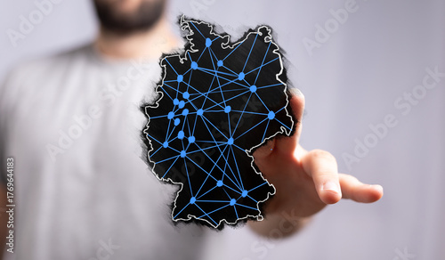 Hand holding digital map of...