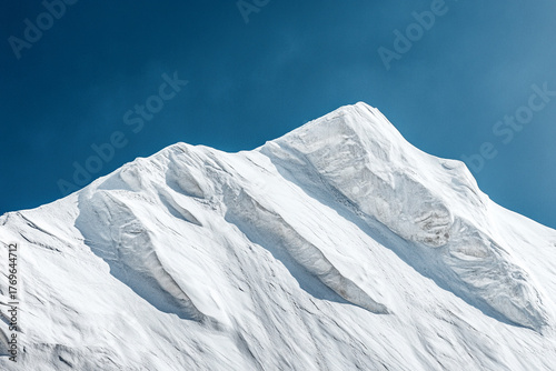 Fototapeta Naklejka Na Ścianę i Meble -  Sharp ridges of a sand dune highlighted against a deep blue sky