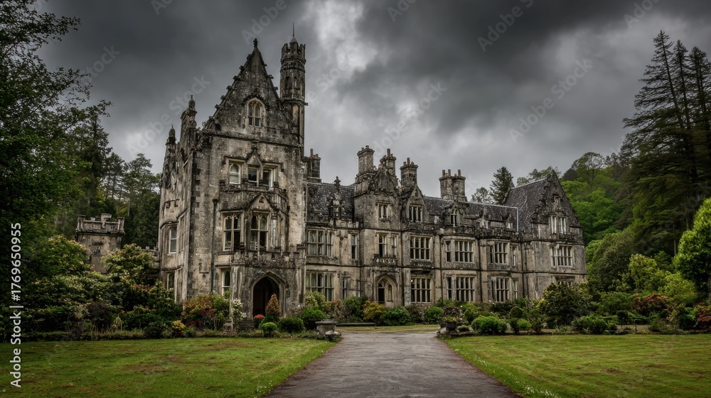 Obraz premium Gothic architecture of a grand mansion looms under dark clouds in a serene garden setting.