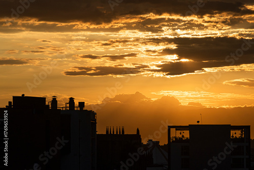 Sunset in the city with beautiful warm tones over the clouds