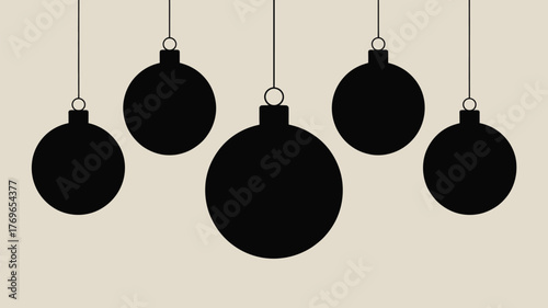 Elegant black Christmas ornaments hung on a neutral background create a modern festive vibe perfect for holiday cards and seasonal designs