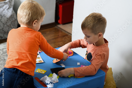 Children Crafting Halloween Decorations at Home