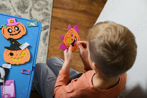 Children Crafting Halloween Decorations at Home