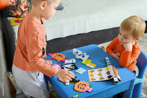 Children Crafting Halloween Decorations at Home