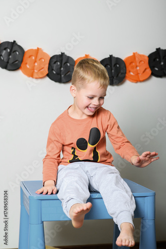 Cute Kids Celebrating Halloween with Pumpkin Buckets and Festive Emotions