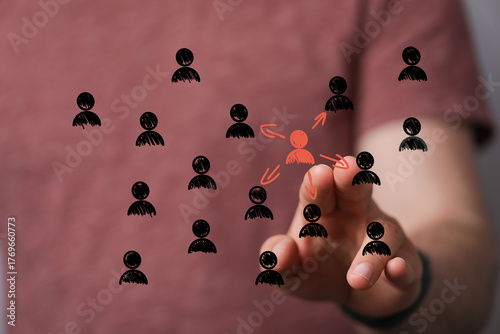 Hand selecting a person fro...