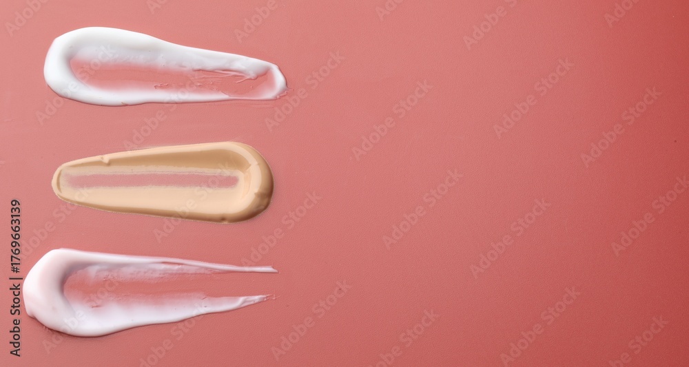 Fototapeta premium Samples of cosmetic product on color background, closeup. Space for text