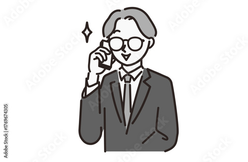スーツを着ている通話中の男性