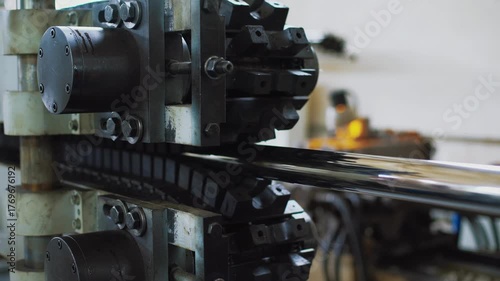 Industrial tank tracks, conveyor sprocket and chain in active movement scene