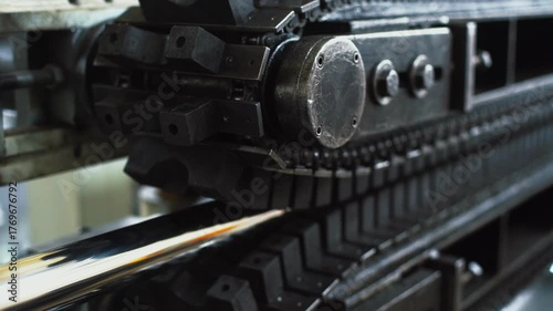 Industrial tank tracks, conveyor sprocket and chain in active movement scene