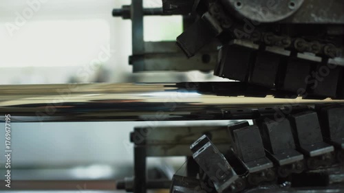 Industrial tank tracks, conveyor sprocket and chain in active movement scene