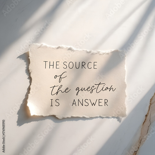 Inspirational handwritten quote on torn paper in soft sunlight, philosophical message.