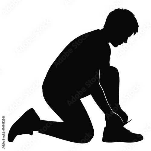 Silhouette of a person kneeling and tying their shoelaces for sports or active lifestyle silhouette