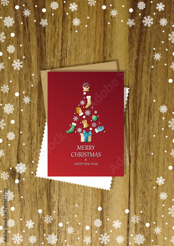 A wooden vertical surface decorated with Christmas decorations, a holiday card lies on the table, creating a warm festive atmosphere