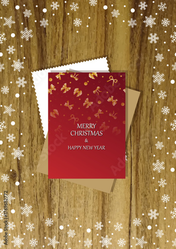 A wooden vertical surface decorated with Christmas decorations, a holiday card lies on the table, creating a warm festive atmosphere