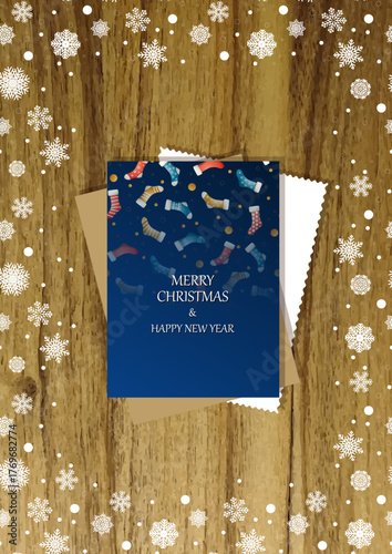 A wooden vertical surface decorated with Christmas decorations, a holiday card lies on the table, creating a warm festive atmosphere