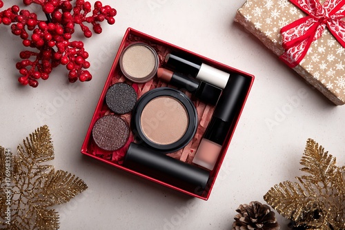 Makeup gift set in a red box with holiday decorations on white background