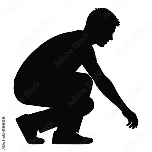Silhouette of a person crouching down and reaching out with one hand silhouette