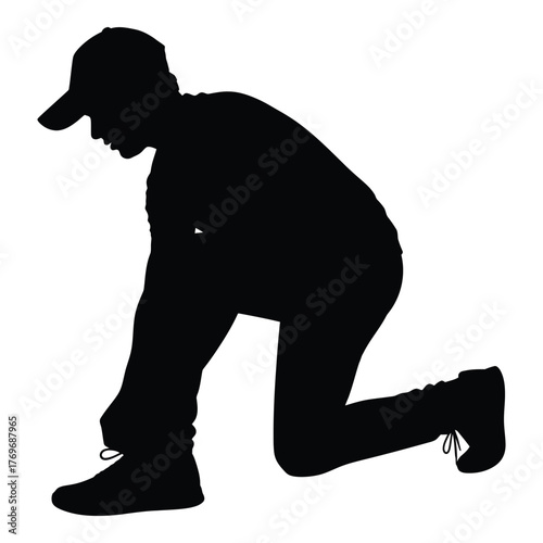 Silhouette of person tying shoelaces ready for action silhouette