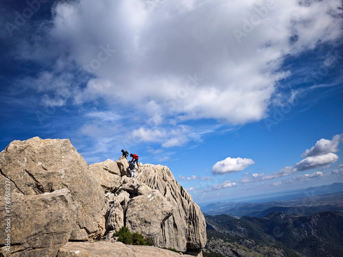 hiker ascending Puig de Alí and Massanella, Escorca, Natural area of the Serra de Tramuntana., Majorca, Balearic Islands, Spain