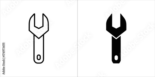 Two icons of a wrench, one outline and one solid black