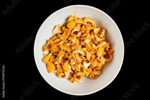 Freshly cleaned chanterelles isolated on black