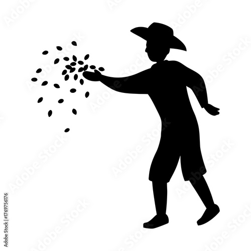 Silhouette of a farmer sowing seeds by hand