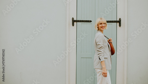 Smiling woman in a light gr...