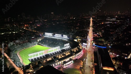 Aerial Night View of Chicago Baseball Stadium Illuminated at Night”