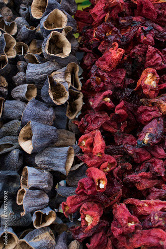 Dried vegetables hanging in a local market. Dried eggplant and red pepper
