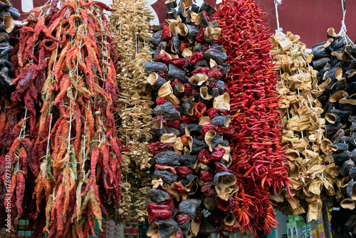 Dried vegetables hanging in a local market. Dried eggplant and red pepper