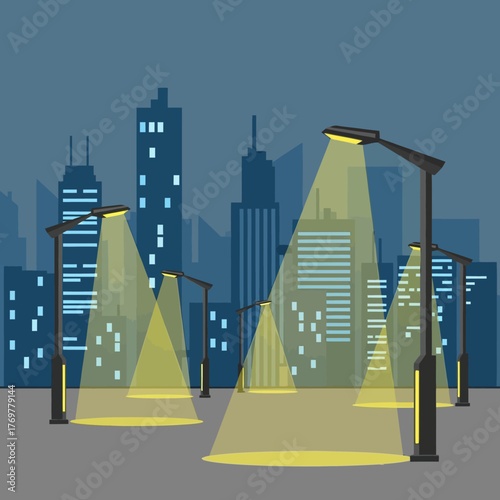 Modern streetlights illuminate a city skyline at dusk with glowing yellow beams.