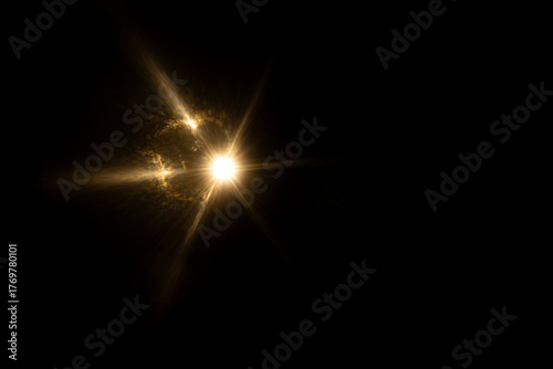 Lens Flare. Light over black background. Easy to add overlay or screen filter over photos. Abstract sun burst with digital lens flare background. Gleams rounded and hexagonal shapes, rainbow halo.